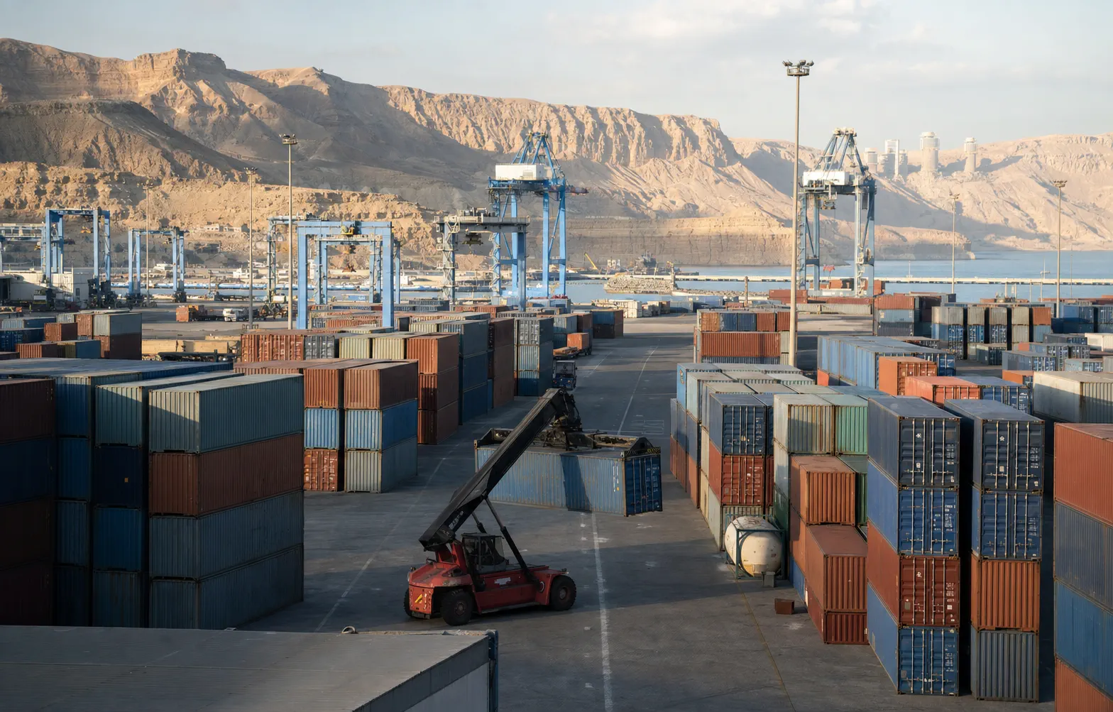 Sokhna container yard with cargo-handling equipment and the Galala plateau