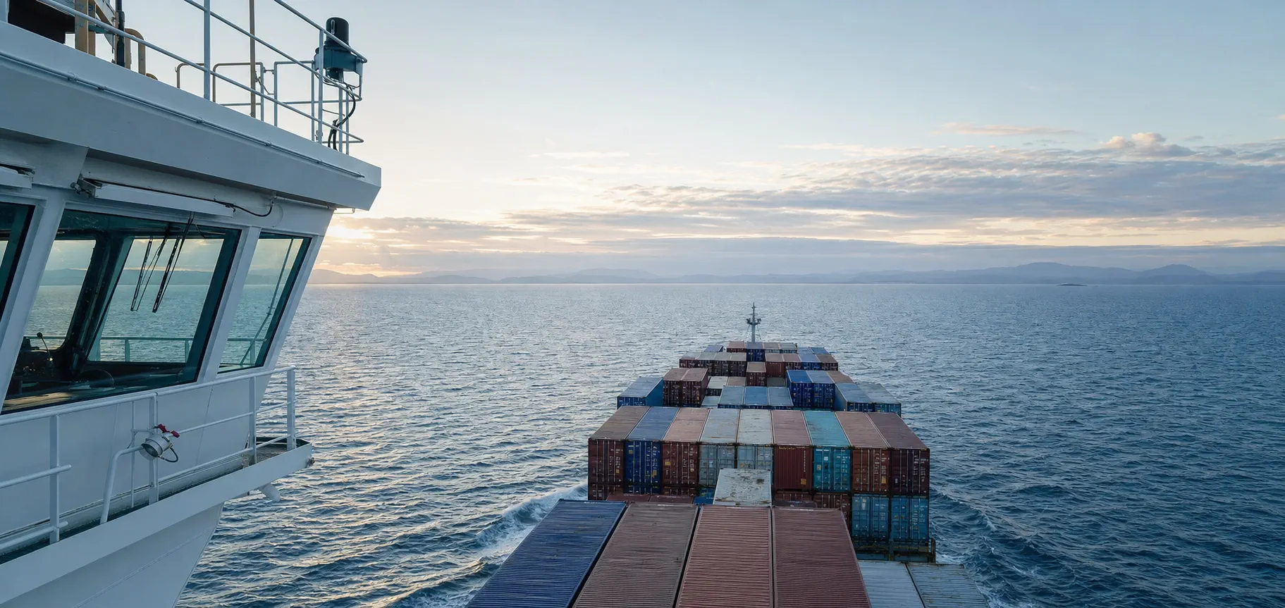Container vessel underway at sea viewed from the bridge wing